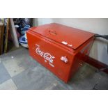 A metal Coca-Cola cooling box