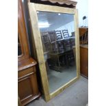 A large pine framed mirror