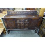 A carved oak sideboard