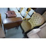 A Victorian mahogany and upholstered nursing chair and a mahogany Sutherland table