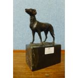 A French style bronze figure of a dog, on black marble socle, 19cms h