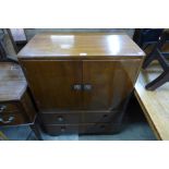 A walnut tallboy and an oak chest of drawers