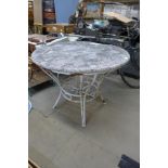 A wrought iron based garden table