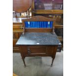 An Edward VII beech and marble topped washstand