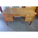 An early 20th Century oak pedestal desk