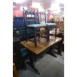 An Ercol oak refectory table and four chairs