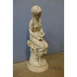 An Italian style reconstituted marble garden figure of a girl