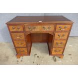 A George II style mahogany kneehole desk