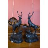 A pair of large French style bronze stags, on black marble plinths, 74cms h