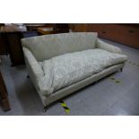 A Victorian mahogany and fabric upholstered country house settee, manner of Howard & Sons