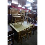 A pine single drawer kitchen table and four beech chairs