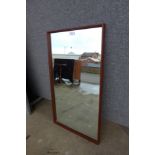 A teak framed mirror