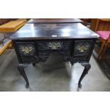 A George II carved oak lowboy