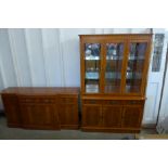 A yew wood breakfront sideboard and matching wall unit