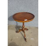 A mahogany tripod wine table