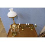 A gilt metal and porcelain table lamp and three wall lights