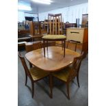 A G-Plan teak extending dining table and five chairs