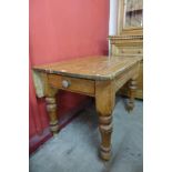 A Victorian pine single drawer drop-leaf kitchen table