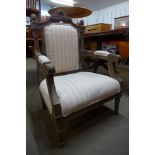 A French style carved beech and upholstered fauteuil