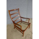 A Parker Knoll teak armchair