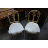 A pair of French Louis XV style giltwood chairs