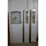 An Art Deco stained glass door and matching side panels