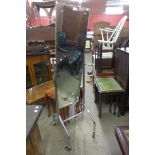 A chrome cheval shop mirror