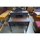 A Victorian Jacobean Revival carved oak writing desk