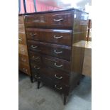 A walnut chest of drawers and a teak chest of drawers