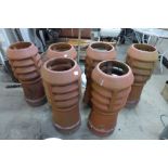 A set of six terracotta chimney pots