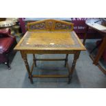 A Victorian carved oak side table