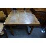 An oak draw-leaf table