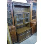 A carved oak bookcase