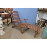 A teak garden lounger chair