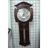 An Arts and Crafts inlaid rosewood aneroid barometer