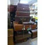 A large quantity of vintage suitcases