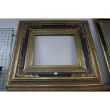 A large Victorian style ebonised and parcel gilt picture frame, 104 x 114cms