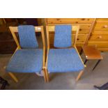 A pair of Ercol beech 775A model chairs and an occasional table