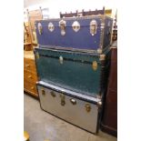 Three large steamer trunks