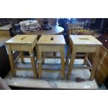 A set of three beech laboratory stools