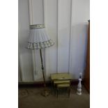 A brass and onyx nest of tables, a standard lamp and a table lamp