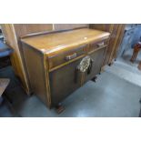 An Art Deco oak sideboard and a tallboy