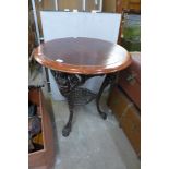 A mahogany and cast iron based pub table