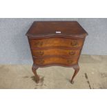 A small walnut chest of drawers