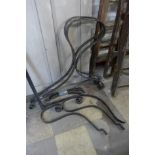 A wrought iron bench frame
