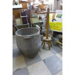 A galvanised dolly tub and wooden dolly peg