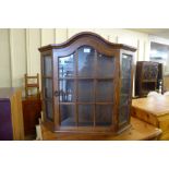 An oak occasional table and a Dutch oak wall hanging cabinet