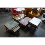 Two teak coffee tables, two tiled top teak nests of tables and a trolley