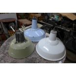 Three enamelled industrial lights