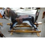 A painted wooden rocking horse